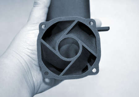 Person holding object printed on powder 3D printer from powder polyamideの写真素材