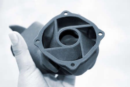 Person holding object printed on industrial powder 3D printer.の写真素材
