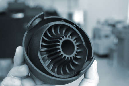Person holding object printed on powder 3D printer from powder polyamide.の写真素材