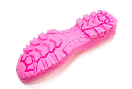 3D printer printed pink shoe soles in natural size isolated on white backgroundの写真素材