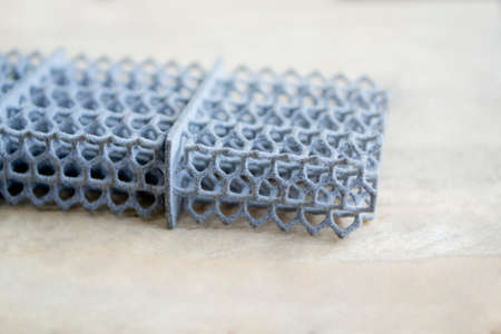Object printed on powder 3D printer from powder polyamide. Gray object formed on under action of thermal print head.の写真素材
