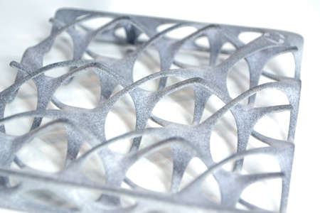 Gray abstract model printed on 3d printer from powder isolatedの写真素材