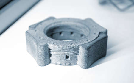 Gray abstract model printed on 3d printer from powder isolatedの写真素材