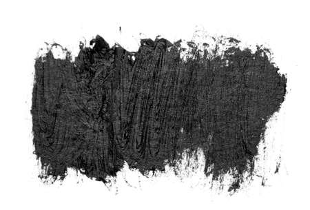 Black brush strokes oil paints on white paper. Isolated on white background.の写真素材