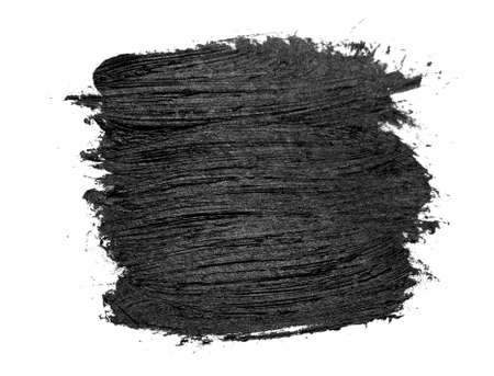 Black brush strokes oil paints on white paper. Isolated on white background.の写真素材