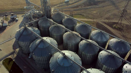 Flight Over Round Metal Barrels of Elevator. Grain Elevator Building Complexの写真素材