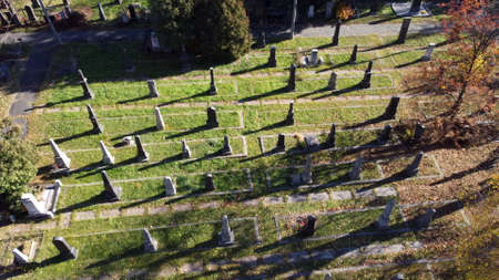 Arial drone view flight over old cemetery with tombstones, gravestones, arrowsの写真素材