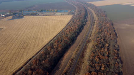 Panoramic Landscape View of Railway, Trees, Agricultural Fields, Lakes on Sunnyの写真素材