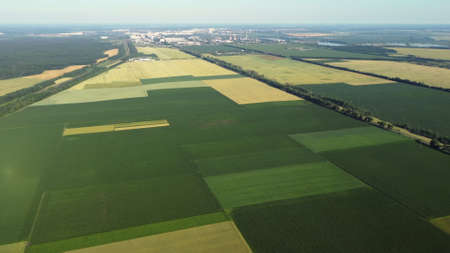 Aerial drone view flight over different agricultural fieldsの写真素材