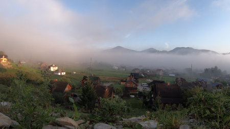 Morning fog dissipates in the mountainsの写真素材