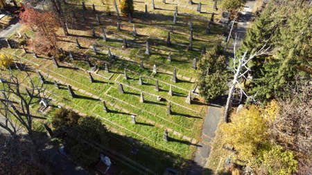 Arial drone view flight over old cemetery with tombstones, gravestones, arrowsの写真素材