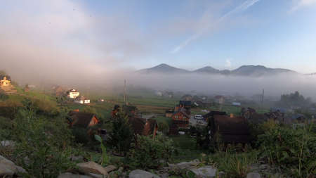 Morning fog dissipates in the mountainsの写真素材