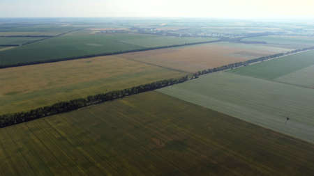 Aerial drone view flight over different agricultural fieldsの写真素材