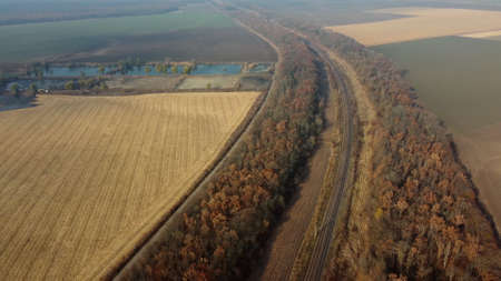 Panoramic Landscape View of Railway, Trees, Agricultural Fields, Lakes on Sunnyの写真素材