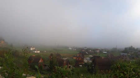 Morning fog dissipates in the mountains Carpathians.の写真素材