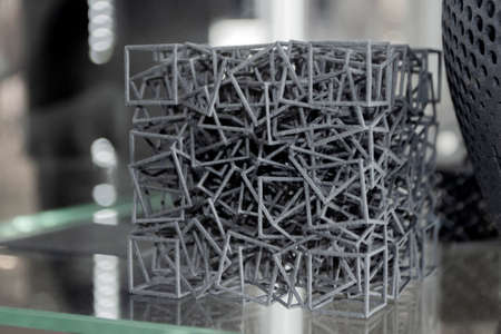 Gray abstract model object printed on 3d printer from powder close-upの写真素材