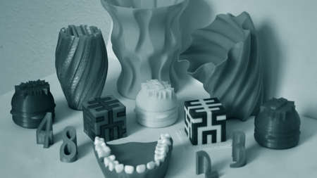 Models printed by 3d printer. Objects printed on 3d printer on tableの写真素材