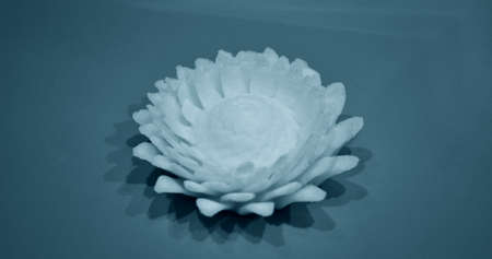 Abstract isolated object flower of a yellow color printed on a 3d printerの写真素材