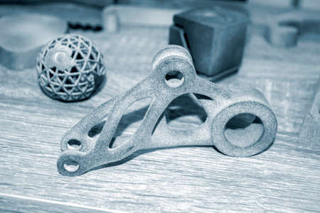 Different gray models printed on 3d printer from powder close-up. 3D prototype