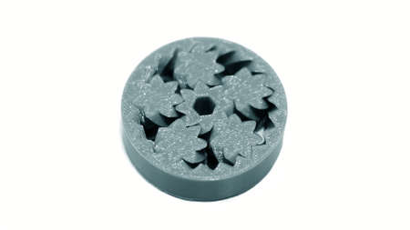 Abstract object of a blue color printed by 3d printer on white backgroundの写真素材