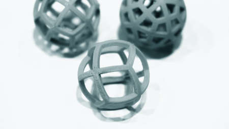 Abstract object of a blue color printed by 3d printer on white backgroundの写真素材