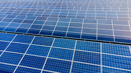 Aerial drone view flight over solar panels on sunny day close-up. Photovoltaicの写真素材