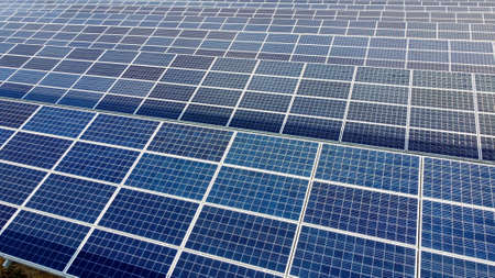 Aerial drone view flight over solar panels on sunny day close-up. Photovoltaicの写真素材