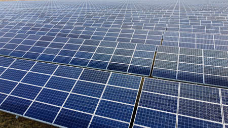 Aerial drone view flight over solar panels on sunny day close-up. Photovoltaicの写真素材