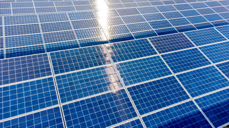 Aerial drone view flight over solar panels on sunny day close-up. Photovoltaicの写真素材