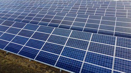 Aerial drone view flight over solar panels on sunny day close-up. Photovoltaicの写真素材