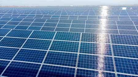 Aerial drone view flight over solar panels on sunny day close-up. Photovoltaicの写真素材