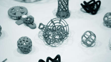 Many abstract models bright colorful objects printed on a 3d printerの写真素材