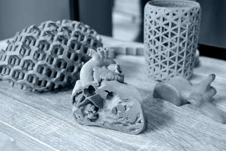 Prototype of human heart and art objects printed on 3d printer.の写真素材