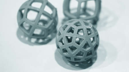 Abstract object of a blue color printed by 3d printer on white background.の写真素材