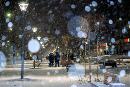 City view, lights, falling snow, night, street, bokeh spotsの写真素材