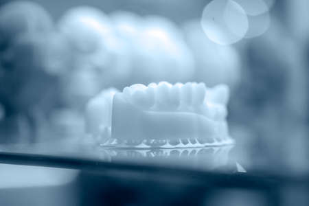 Objects printed on a 3d printer made of white plastic close-up.の写真素材