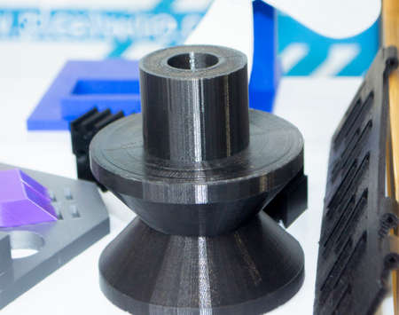 Objects printed on 3d printer made of white plastic close-up.の写真素材