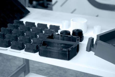 Objects printed on 3d printer made of white plastic close-up.の写真素材