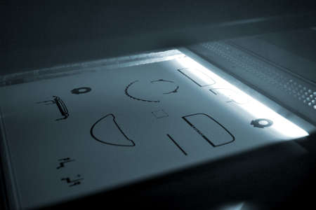 Powder 3D printer printing models from white powder polyamide close-upの写真素材