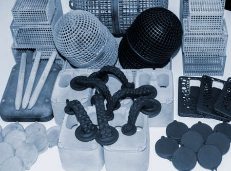Many different objects printed on 3D printer from powder polyamide.の写真素材