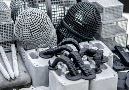 Many different objects printed on 3D printer from powder polyamide.の写真素材