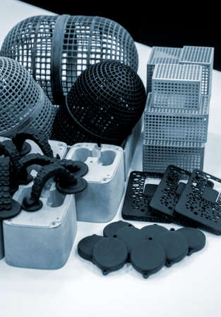 Many different objects printed on 3D printer from powder polyamide.の写真素材