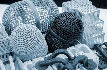 Many different objects printed on 3D printer from powder polyamide.の写真素材