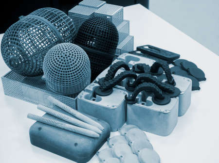 Many different objects printed on 3D printer from powder polyamide.の写真素材