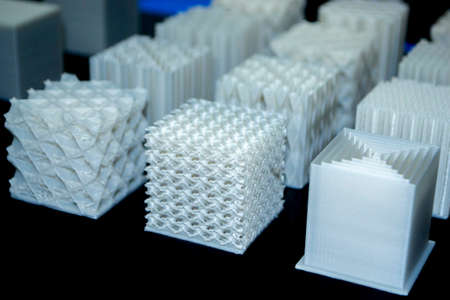 White models prototypes printed on a 3D printer from plastic close-upの写真素材