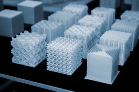 White models prototypes printed on a 3D printer from plastic close-upの写真素材