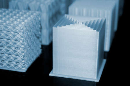 White models prototypes printed on a 3D printer from plastic close-upの写真素材