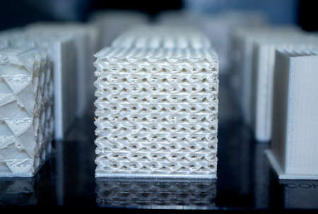 White models prototypes printed on a 3D printer from plastic close-upの写真素材
