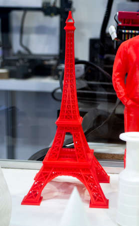 Red model printed on a 3D printer from plastic close-upの写真素材