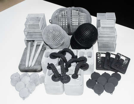 Many models printed on 3D printer. Gray and black objects printed 3D printer.の写真素材